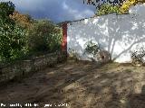 Molino de Puertollano. Piedra de molino y muro de piedra