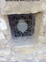 Iglesia de San Milln. Reja del Sagrado Corazn en ventana del stano